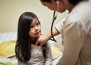 Child is examined by nurse